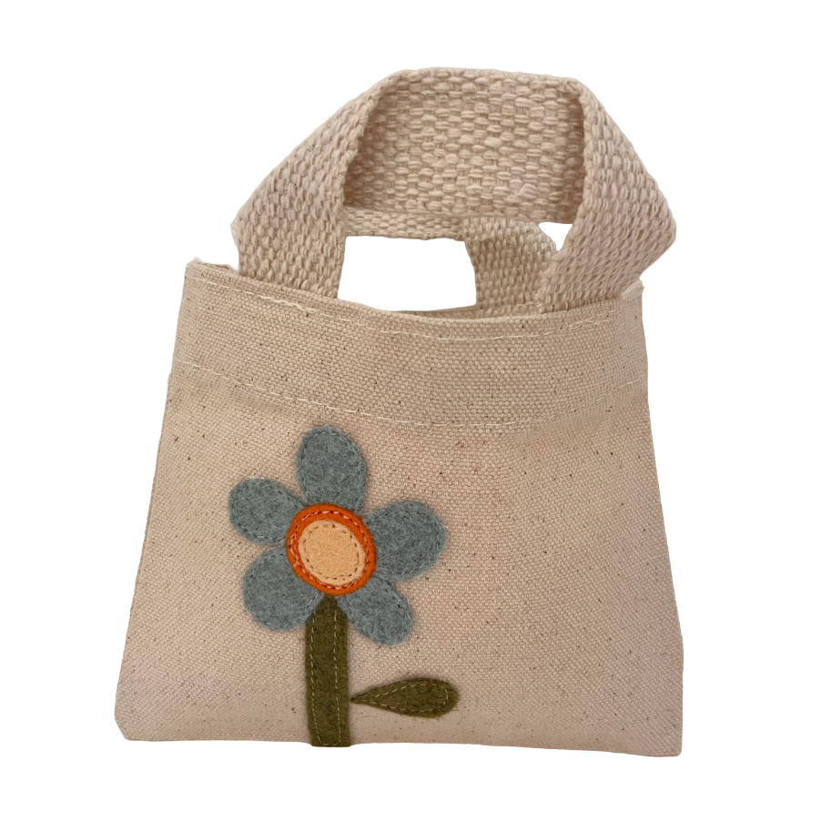 Beige handbag with a flower design on a white background