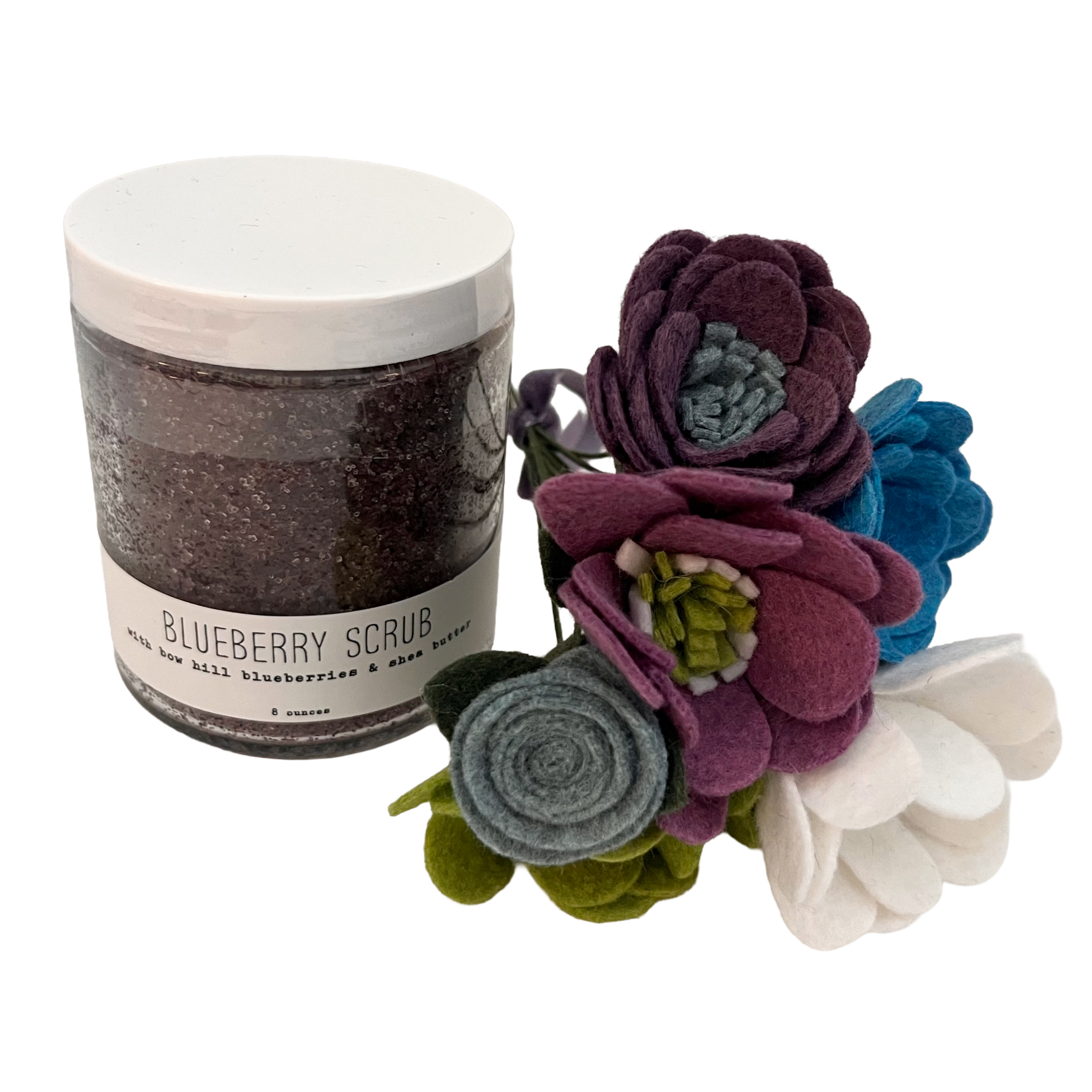 Jar of blueberry scrub with decorative flowers on a white background