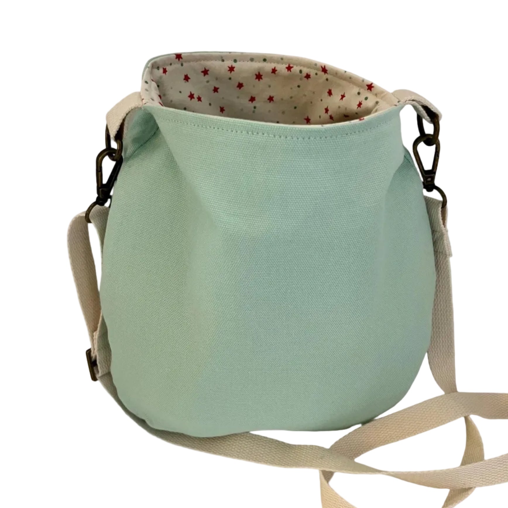 Light blue bucket bag with a strap on a white background