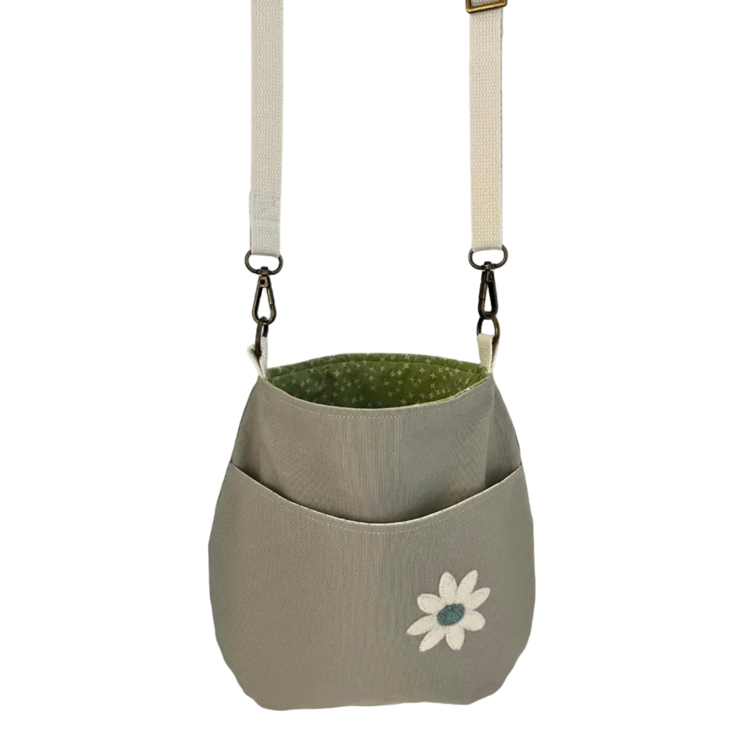 Green and gray bag with a flower design on a white background