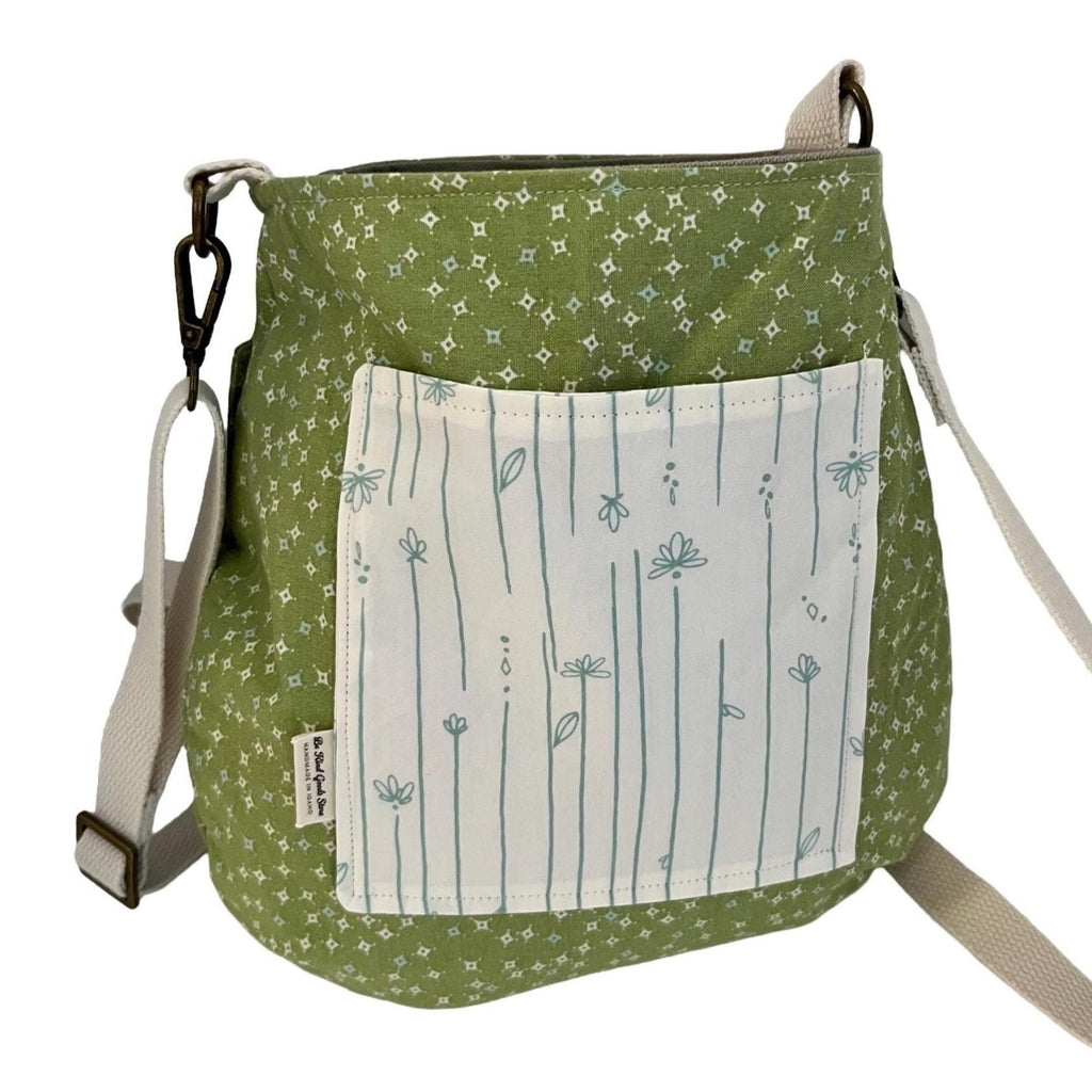Green patterned bag with a white pocket on a white background