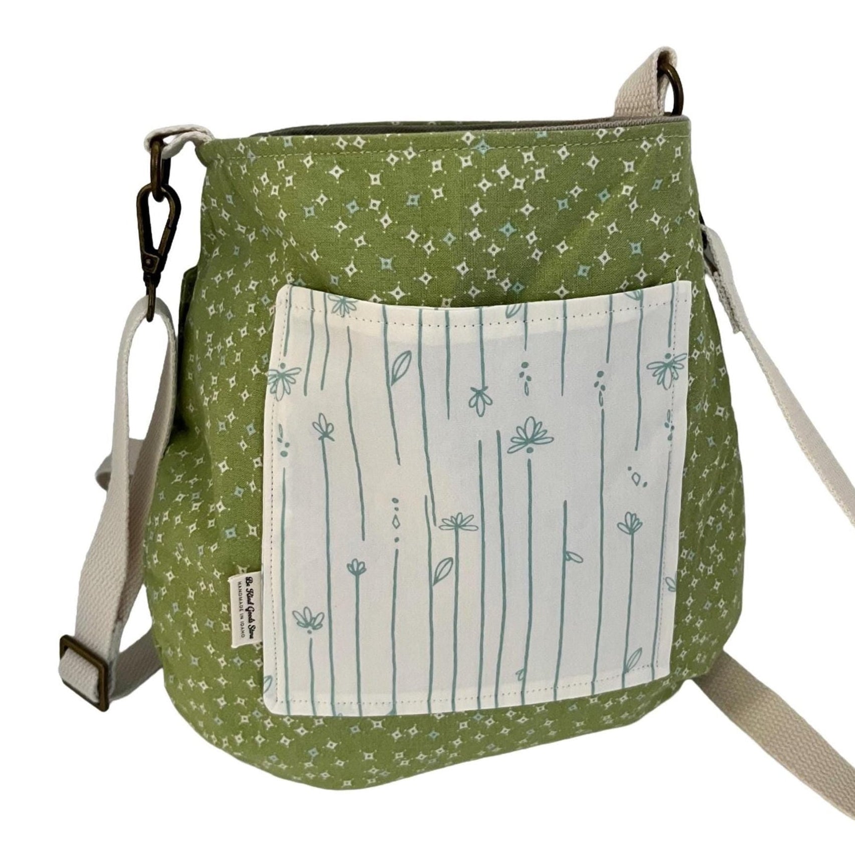 Green patterned bag with a white pocket on a white background