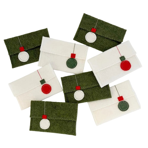 Set of small felt envelopes with decorative elements on a white background