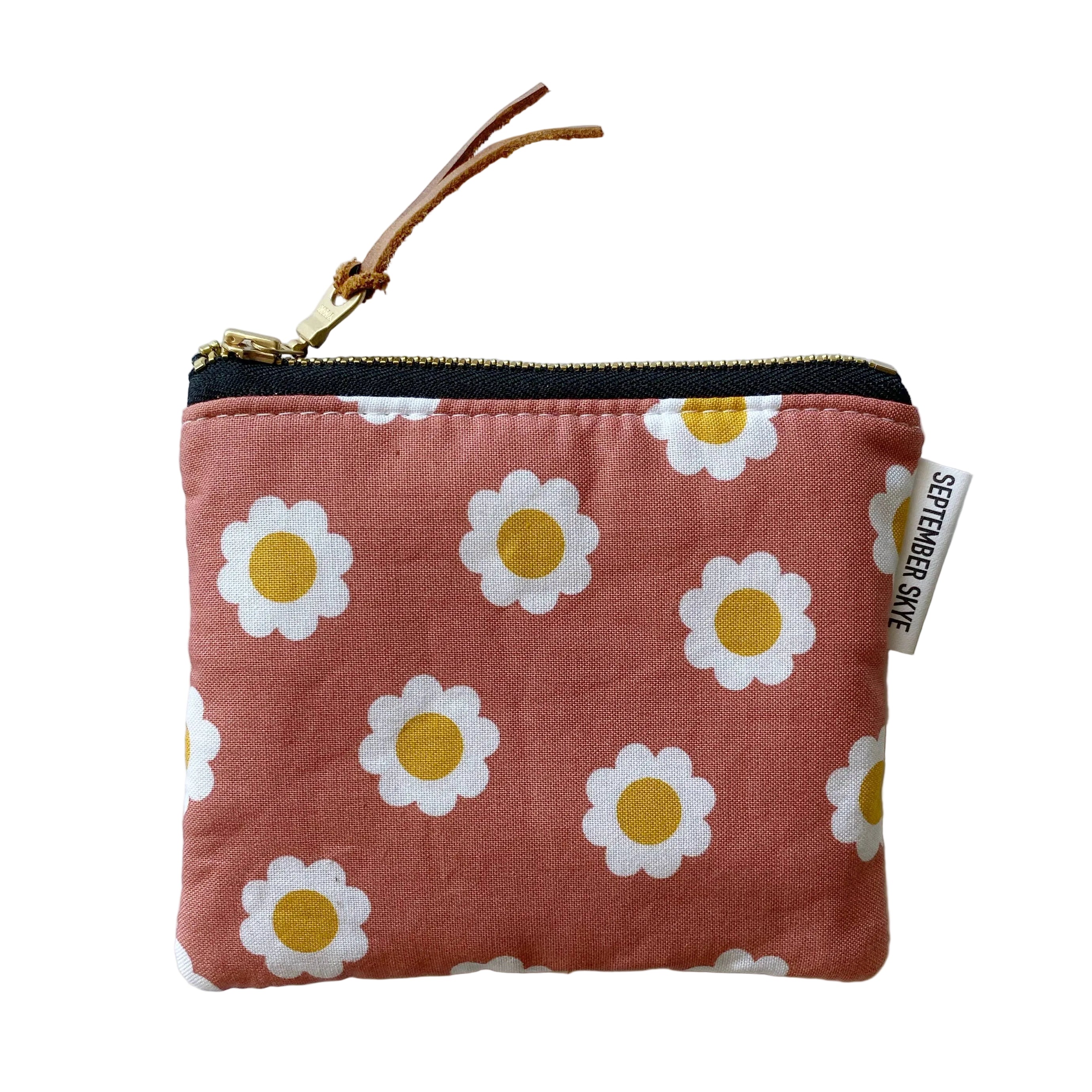 Small pouch with daisy pattern on a white background