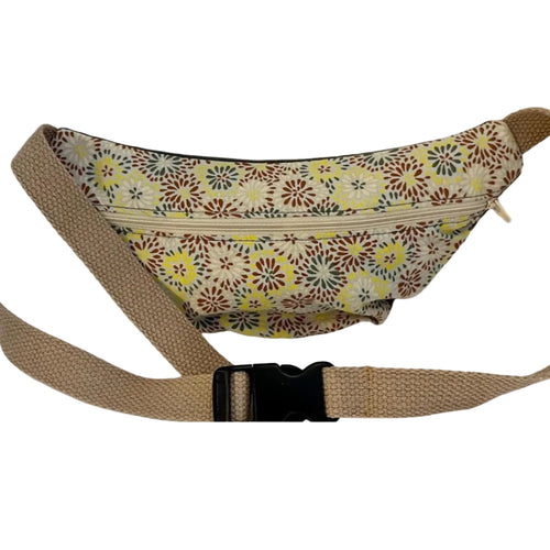 Floral-patterned waist bag with a brown strap on a white background