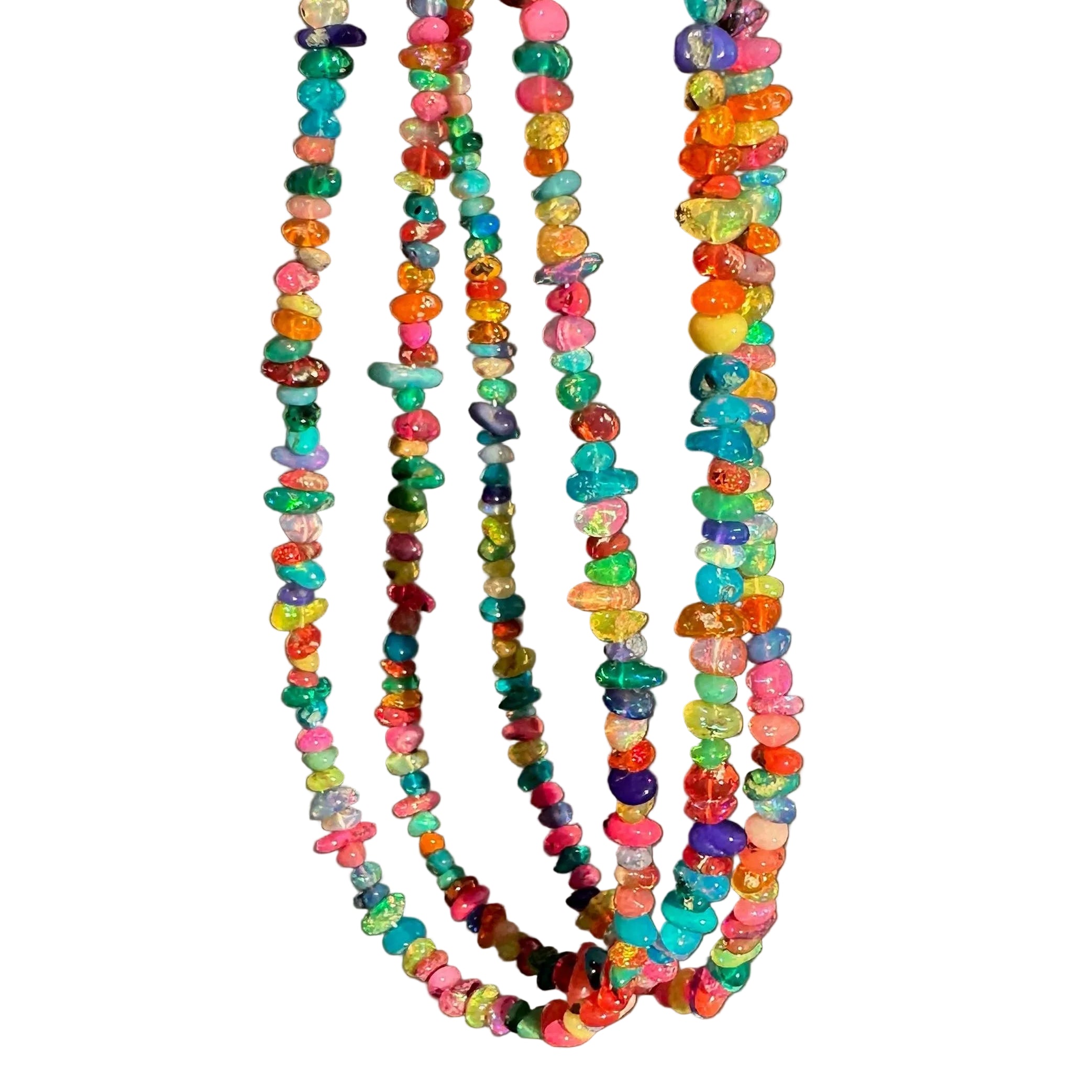 A close-up of a hand holding three strands of colorful seed bead necklaces against a plain gray background.