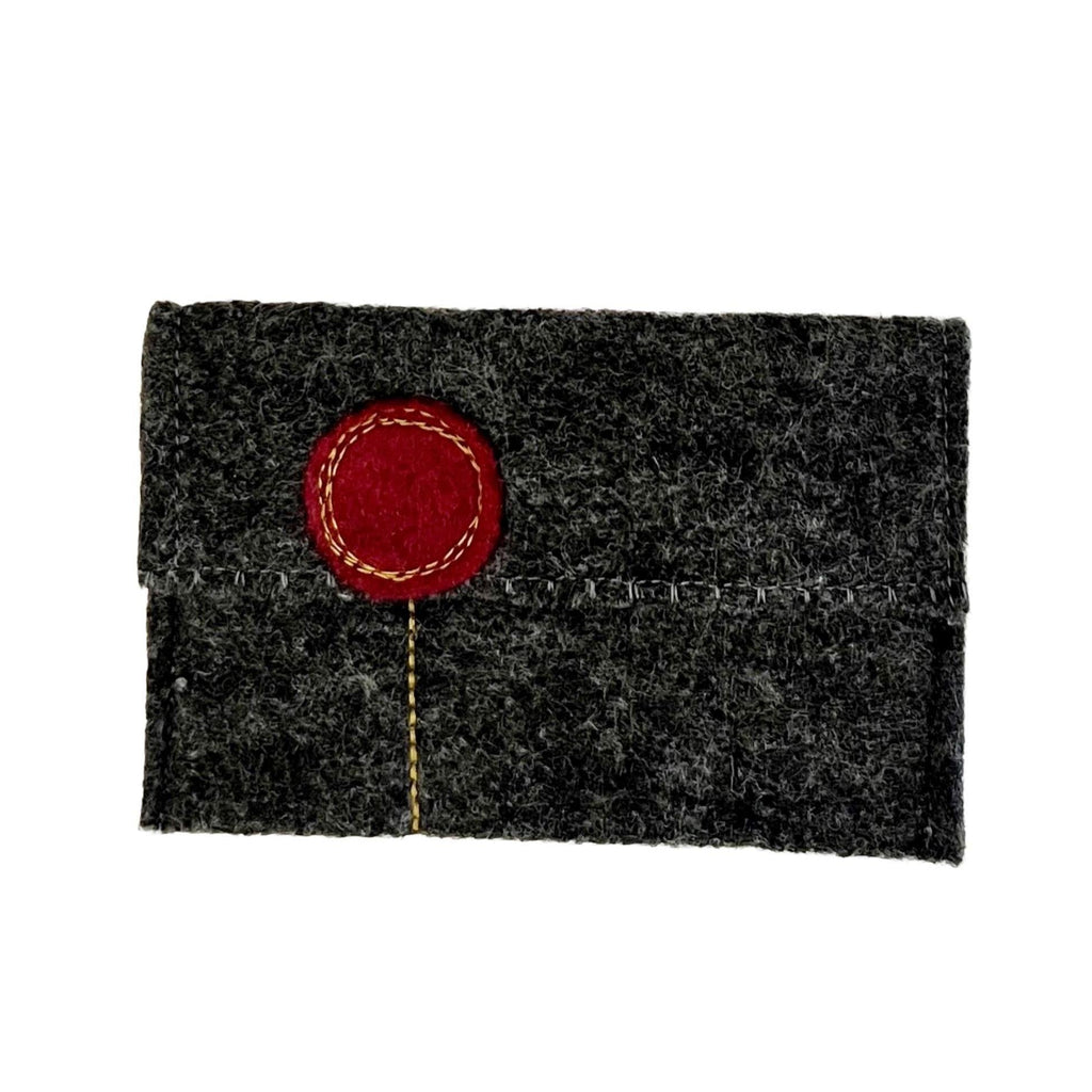 Dark gray felt cardholder with a red circular patch on a white background