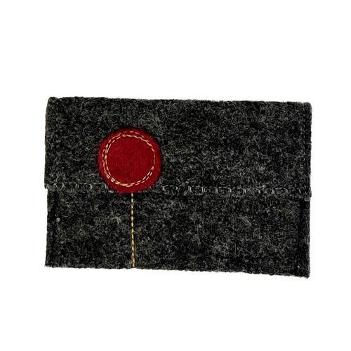 Dark gray felt cardholder with a red circular patch on a white background