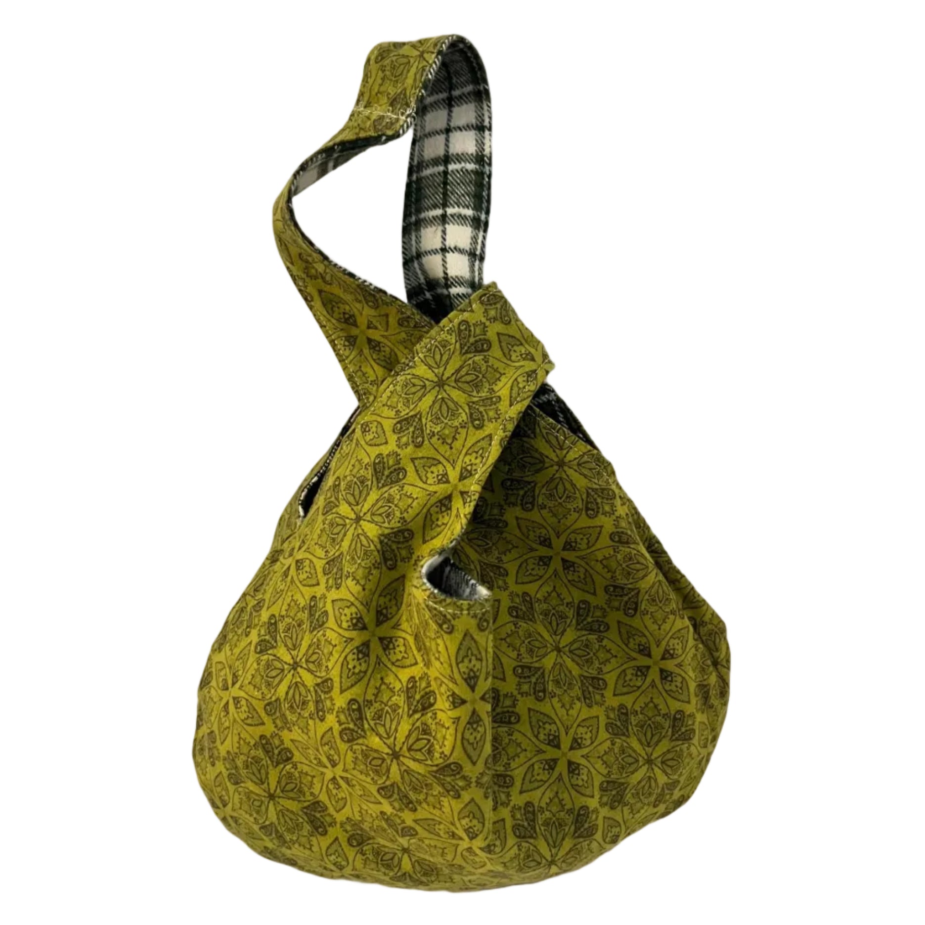 Green patterned fabric bag with plaid interior on a white background