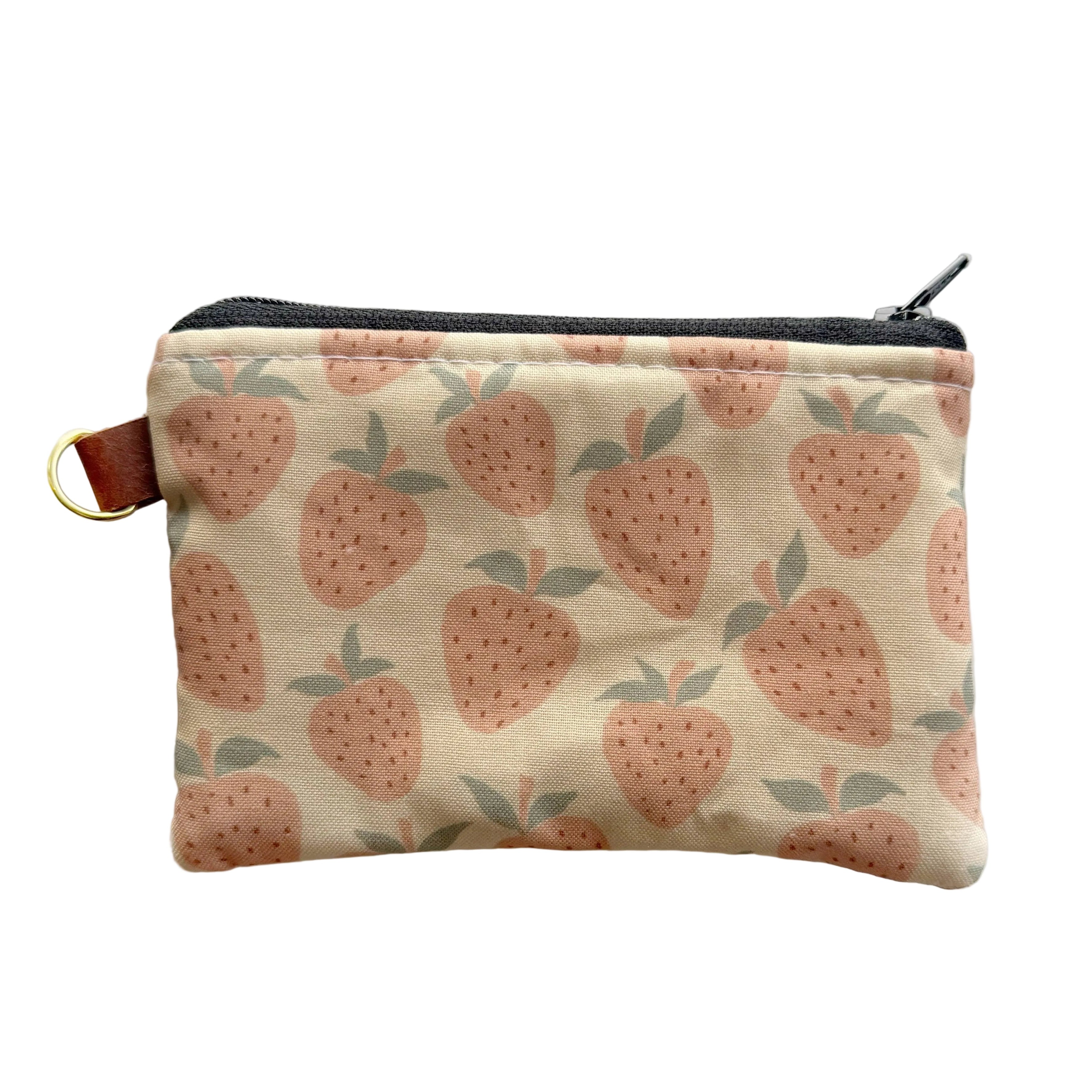 Small pouch with strawberry pattern on a white background