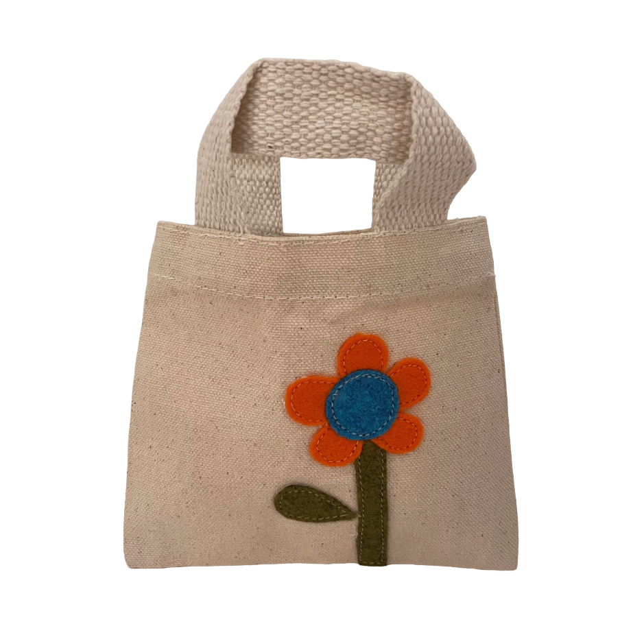 Small beige jute bag with a flower design on a white background