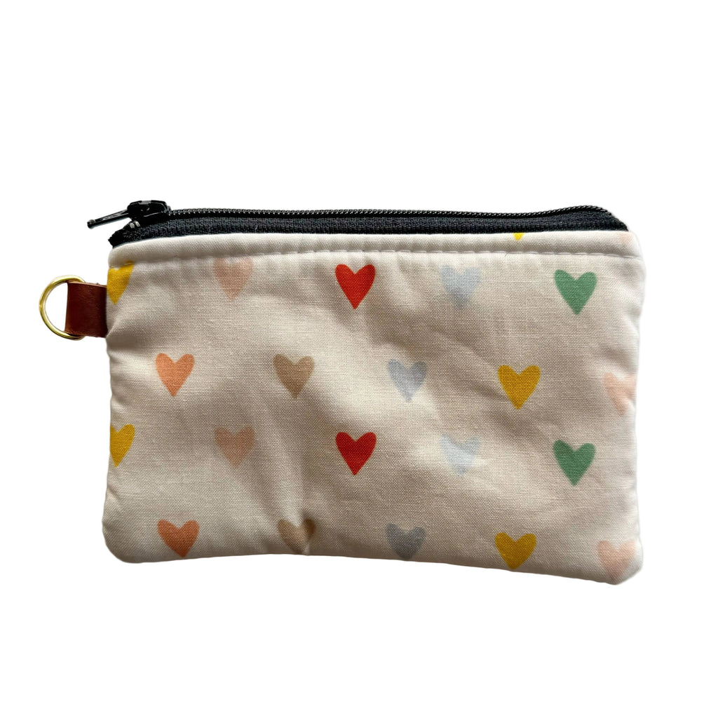 Small pouch with colorful heart pattern on a white background