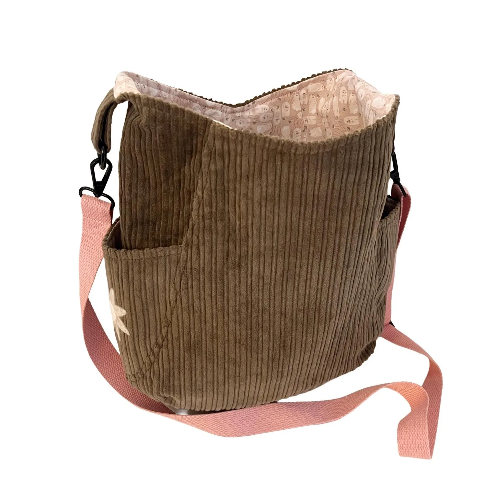 Army green textured bag with a pink strap on a white background