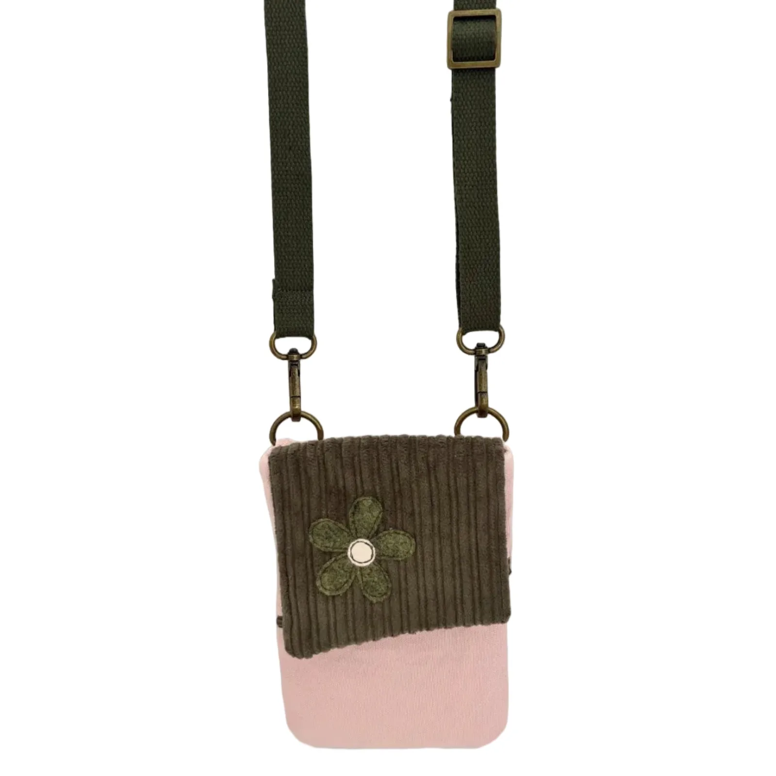 Crossbody bag with green floral design and pink bottom section on a white background