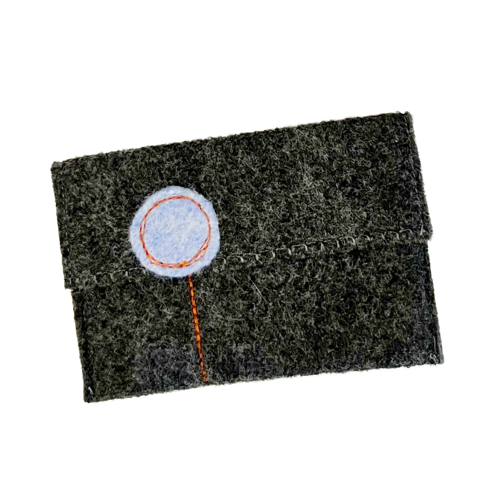 Dark gray felt pouch with a circular patch on a white background