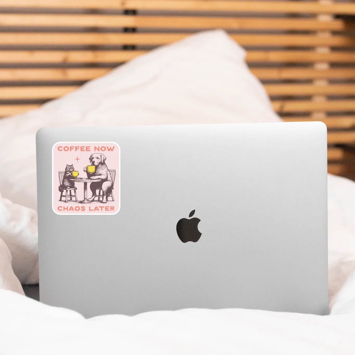 Laptop with a sticker on a bed