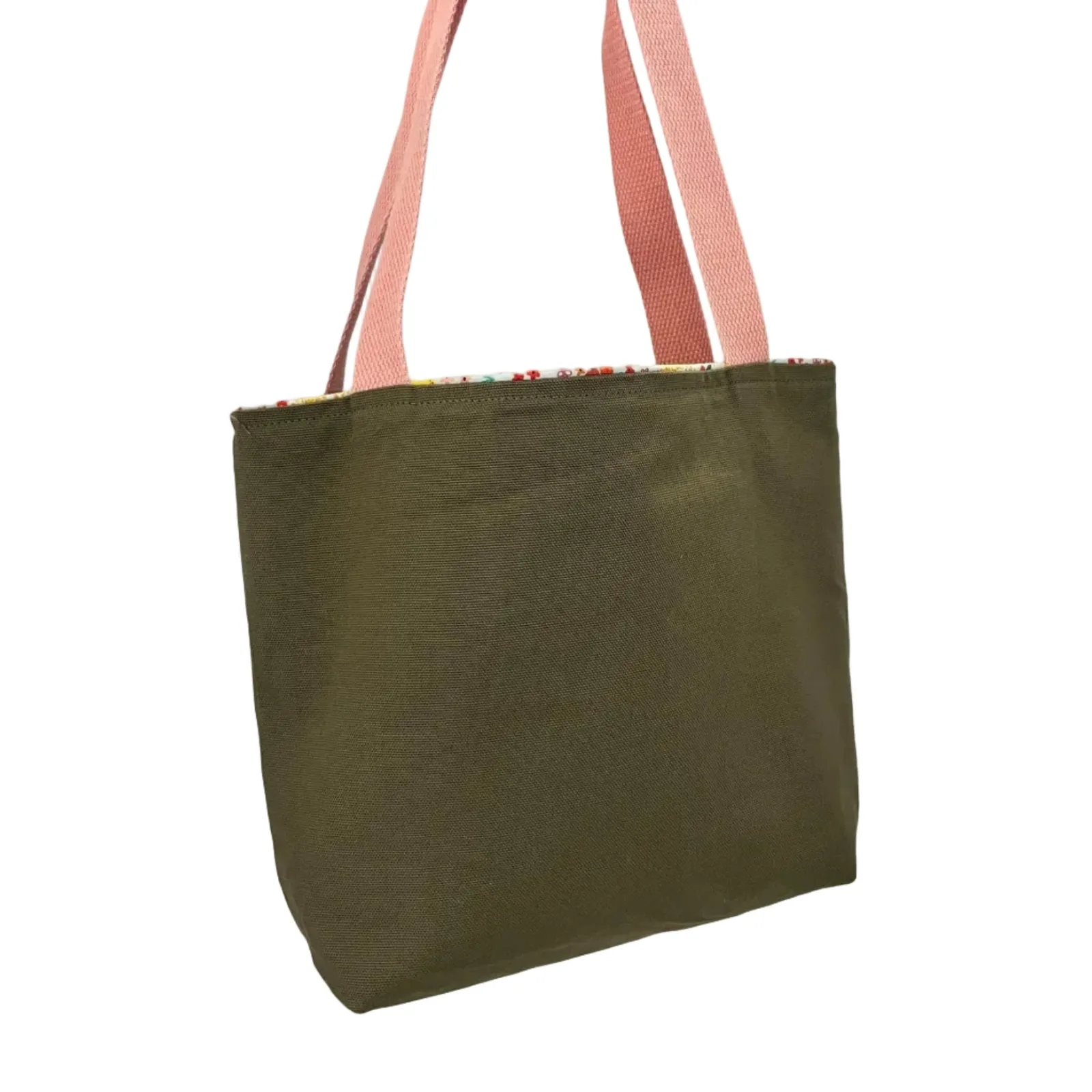 Green tote bag with pink straps on a white background