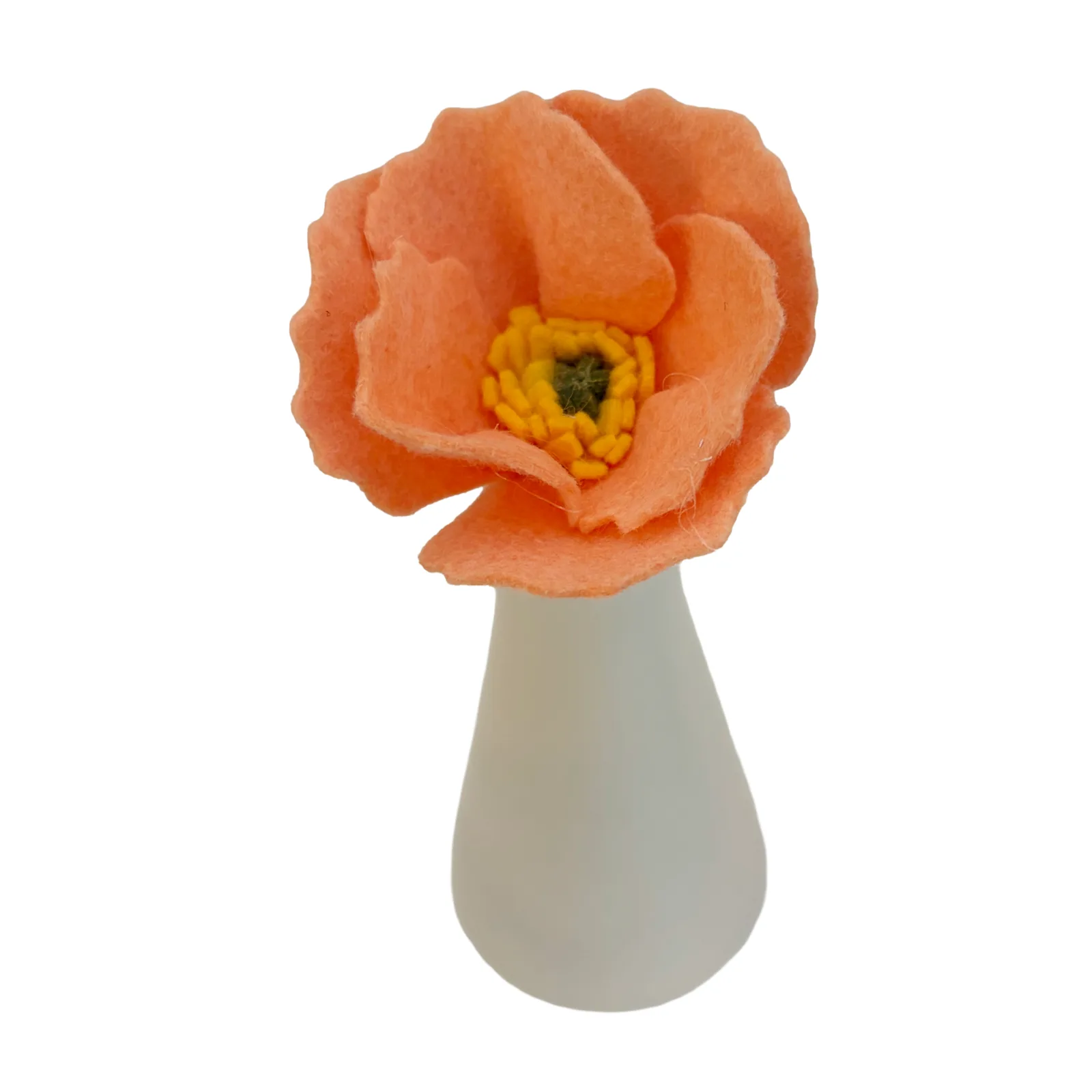 A peach poppy felt flower with a textured green and yellow center