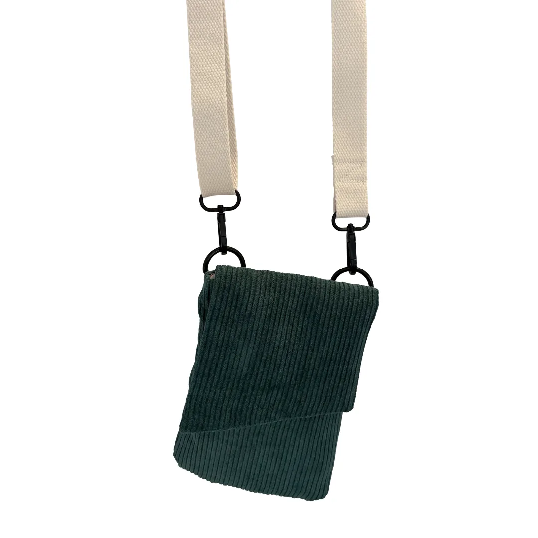A teal green corduroy pouch bag with a cream-colored webbed shoulder strap and black metal hardware, shown against a plain white background.