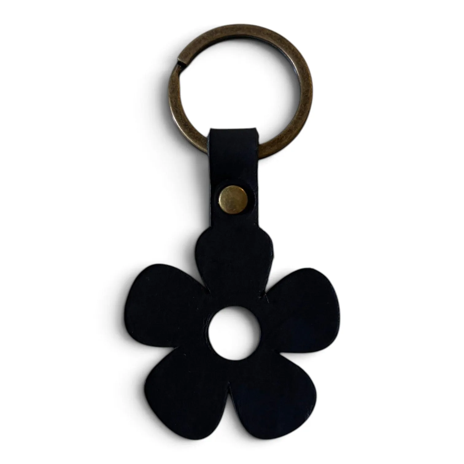 A black flower-shaped keychain with five petals and a brass key ring, shown on a plain white background.