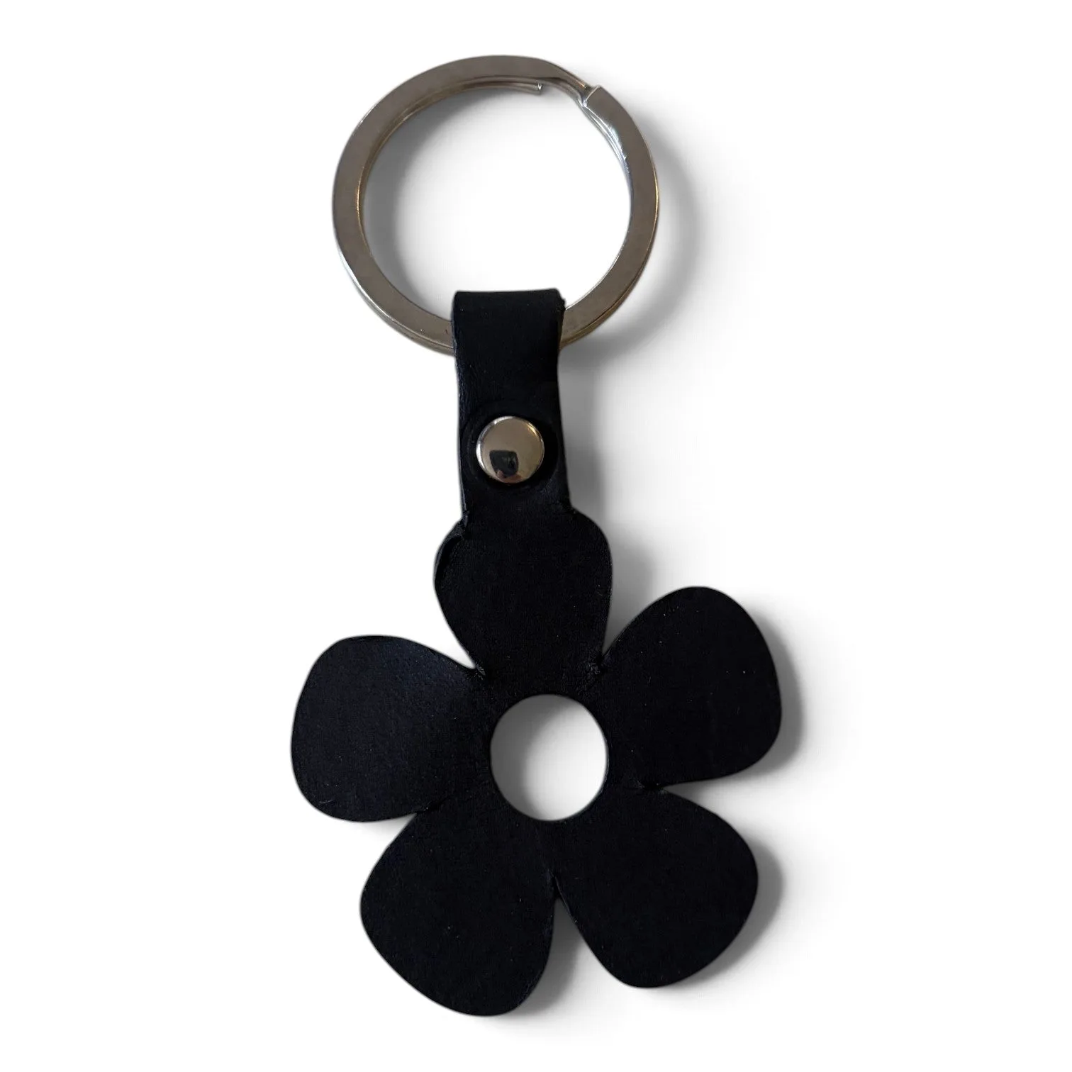 A black flower-shaped keychain with five petals and a silver metal split ring, shown on a plain white background.