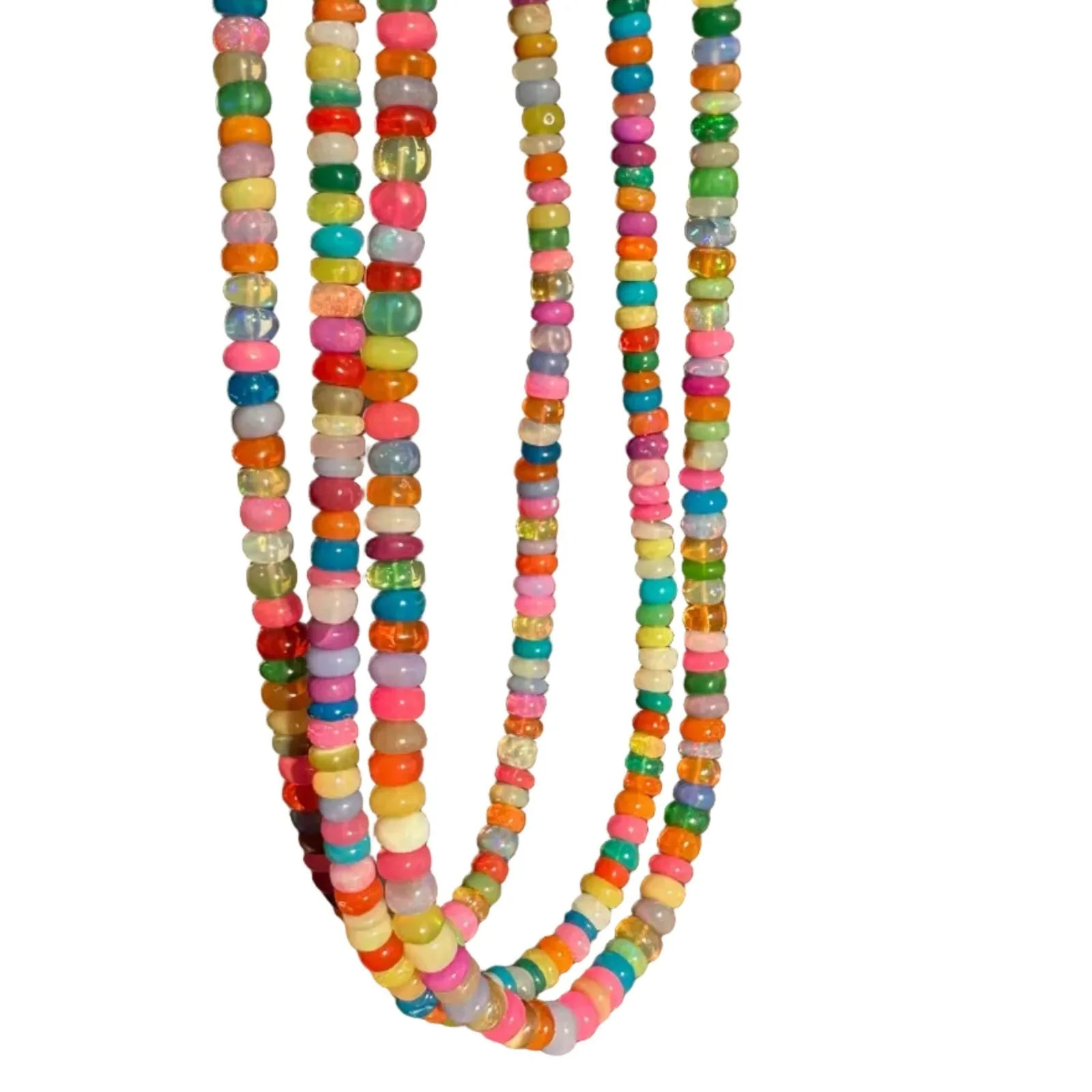 A close-up of a hand holding a long strand of colorful round beads, likely a necklace or bracelet, against a plain gray background.