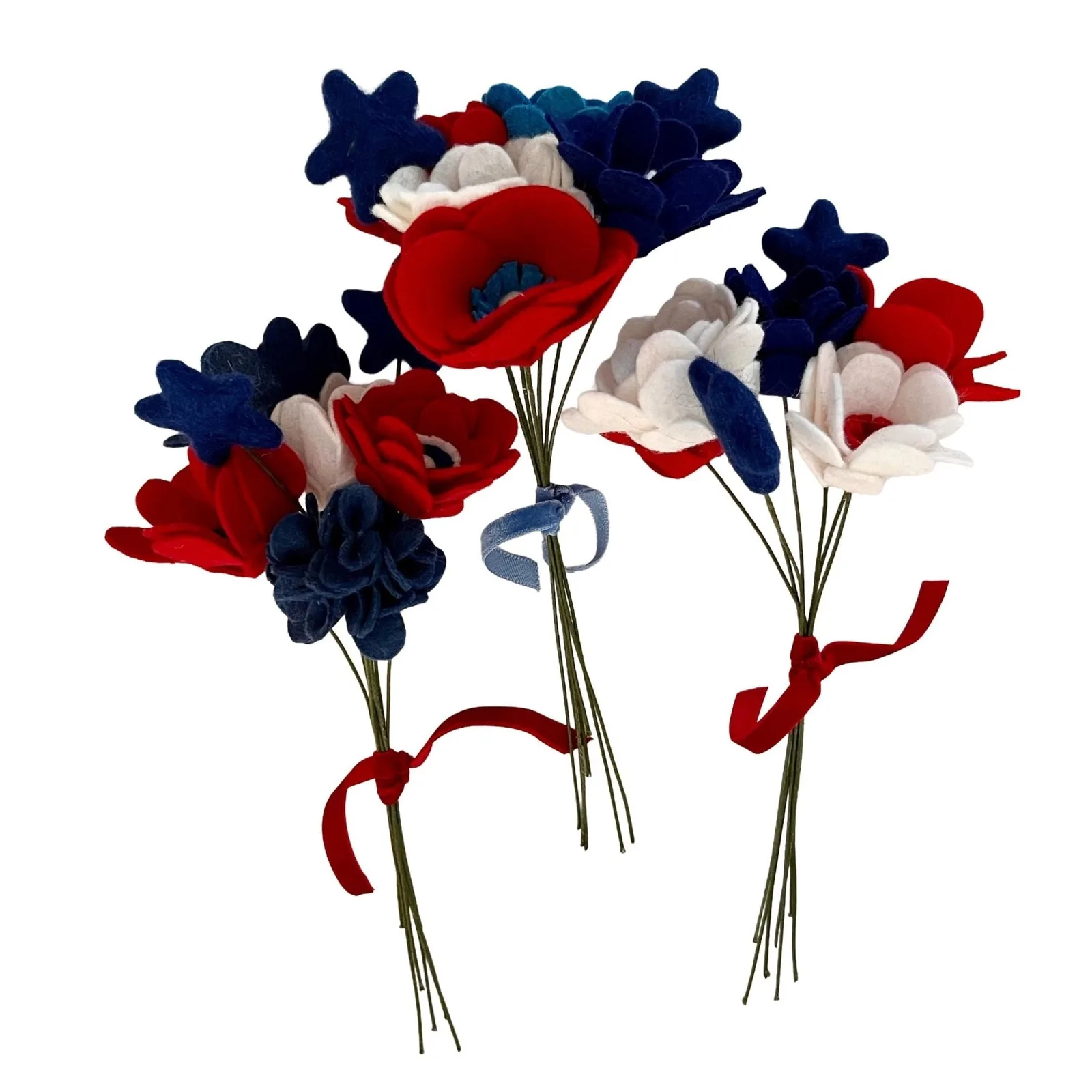 Decorative flowers in red, white, and blue with ribbons on a white background