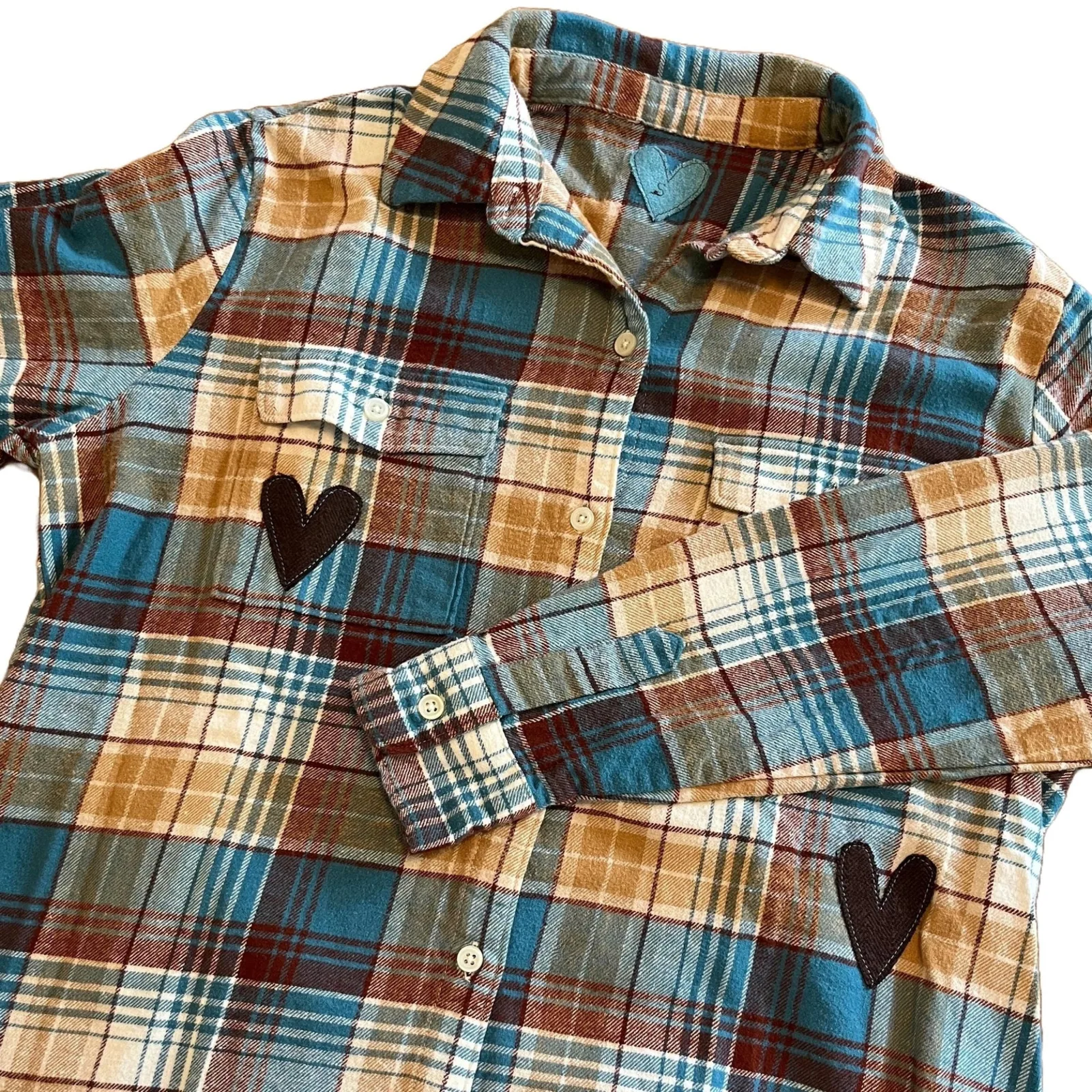 Plaid shirt with heart designs on a white background