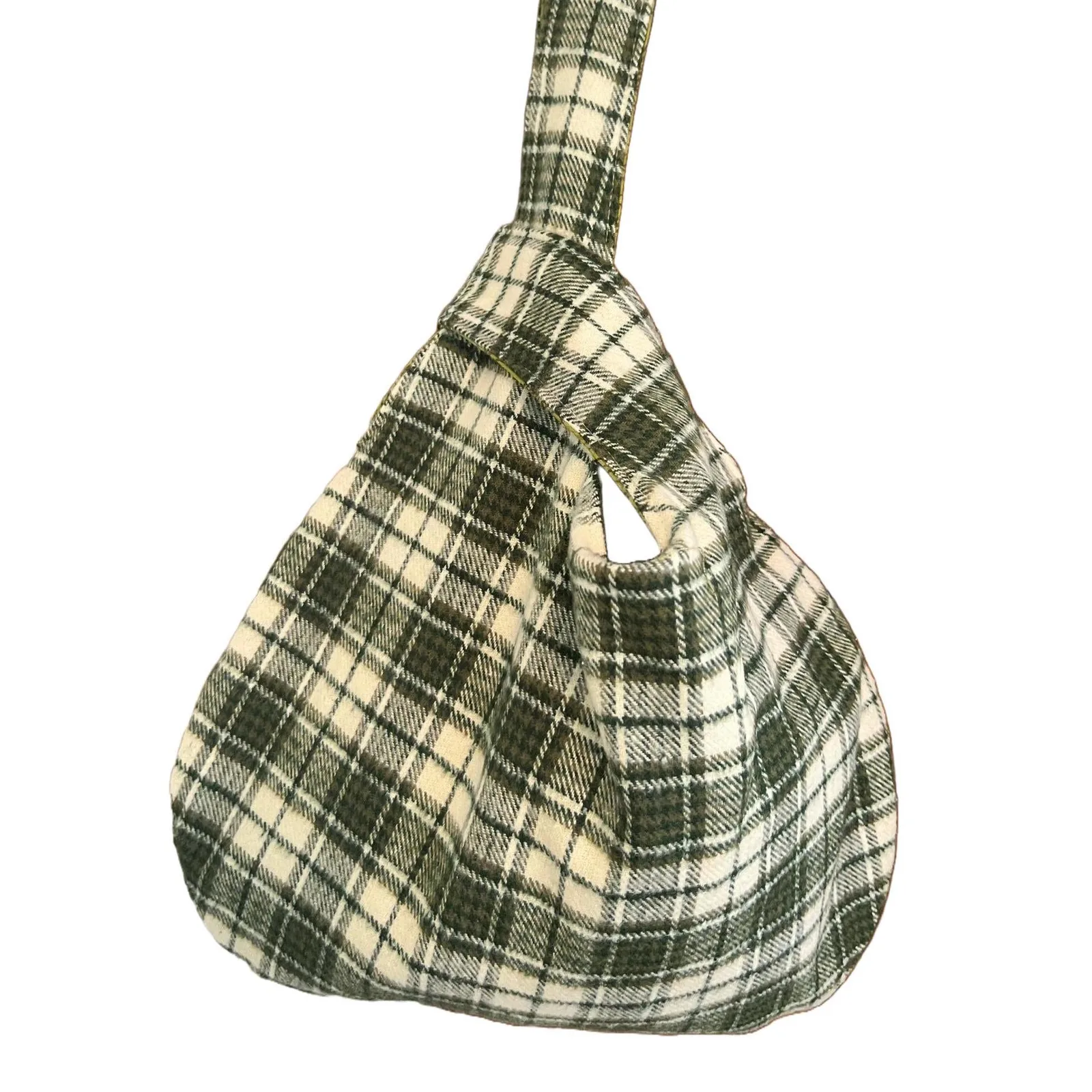 Plaid handbag with a strap on a white background