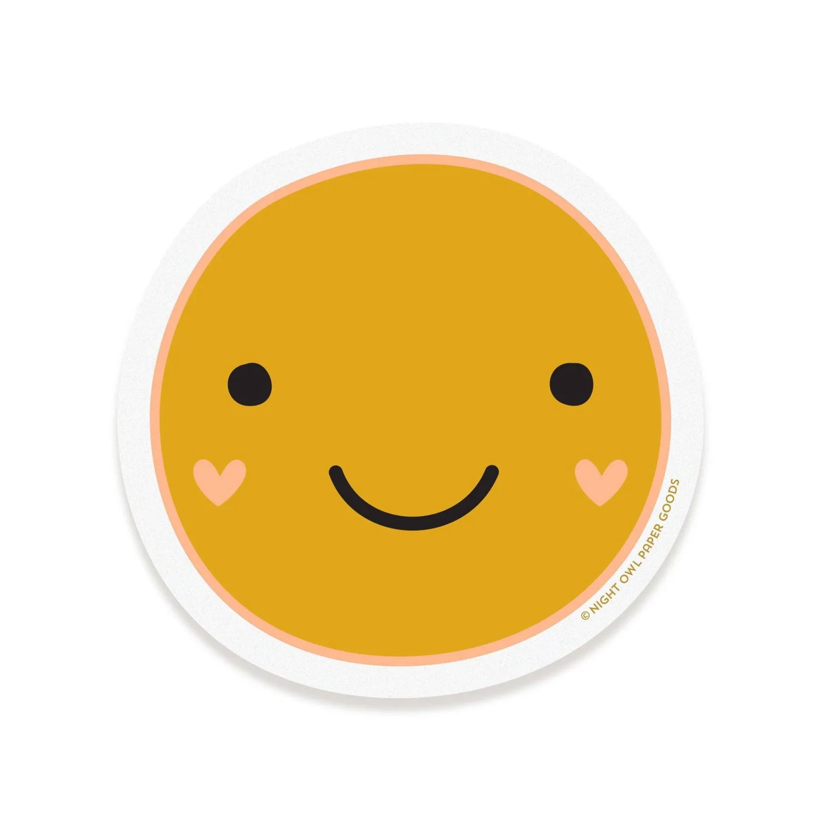 A round sticker featuring a cute yellow smiley face with black eyes and a smile, accented by small pink hearts on its cheeks, shown on a white background.