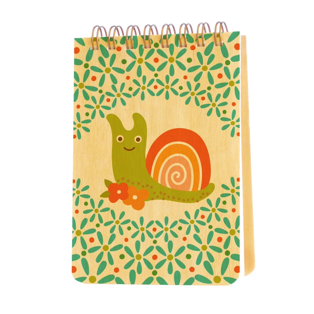 A spiral-bound wooden notebook with a colorful snail illustration on the cover, set against a plain white background.