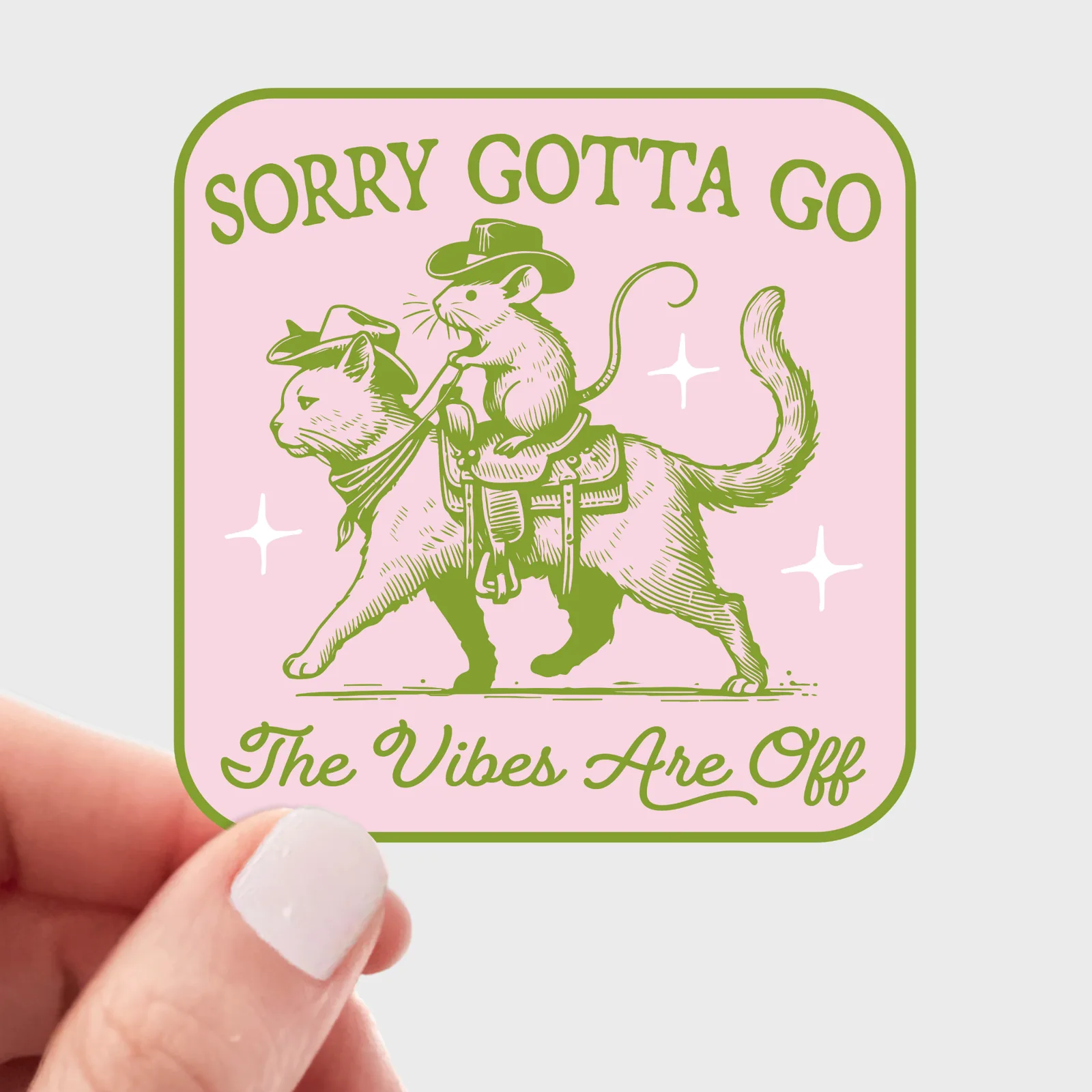 Sticker with a rat riding a dog and text 'Sorry Gotta Go, The Vibes Are Off' held by a hand.